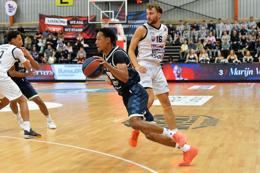 Brussels' Jamison Overton and Limburg's Wout Leemans pictured in action during a basketball match between Limburg United and Brussels, Friday 03 October 2025 in Mechelen, on day 2 of the 'BNXT League' Belgian/ Dutch first division basket championship. BELGA PHOTO JILL DELSAUX