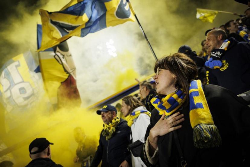 Supporters of Royale Union Saint-Gilloise celebrate after a goal during the Belgian Pro League playoff football match between Royale Union Saint-Gilloise and KRC Genk at the Joseph Marien Stadium in Brussels on May 3, 2025.   Simon Wohlfahrt / AFP