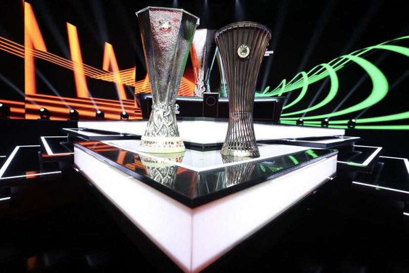 This photograph taken on August 28, 2026 shows the Europa League trophy (L) and Conference League trophy (R) during the draw ceremony for the league phase of the 2026-2027 UEFA Europa and Conference League football tournaments at the Grimaldi Forum in the Principality of Monaco.  Valery HACHE / AFP
