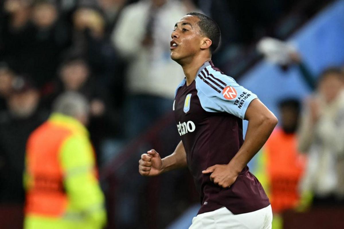 Aston Villa's Belgian midfielder #08 Youri Tielemans reacts after scoring the team's second goal  during the UEFA Champions League quarter-final second-leg football match between Aston Villa and Paris Saint-Germain at Villa Park in Birmingham, central England on April 15, 2025.  Paul ELLIS / AFP