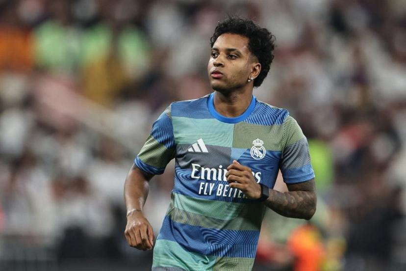 Real Madrid's Brazilian forward #11 Rodrygo warms up prior to the start of the Spanish Super Cup final football match between FC Barcelona and Real Madrid at the King Abdullah Stadium in Jeddah on January 11, 2026.  Fadel SENNA / AFP