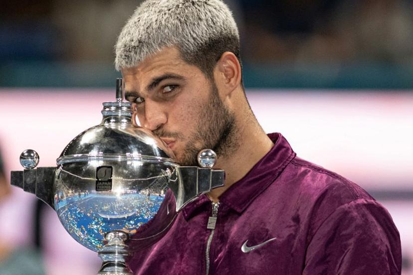 Spain's Carlos Alcaraz celebrates during the award ceremony after winning the men's singles final match against USA's Taylor Fritz at the ATP Japan Open tennis tournament in Tokyo on September 30, 2025.  Philip FONG / AFP