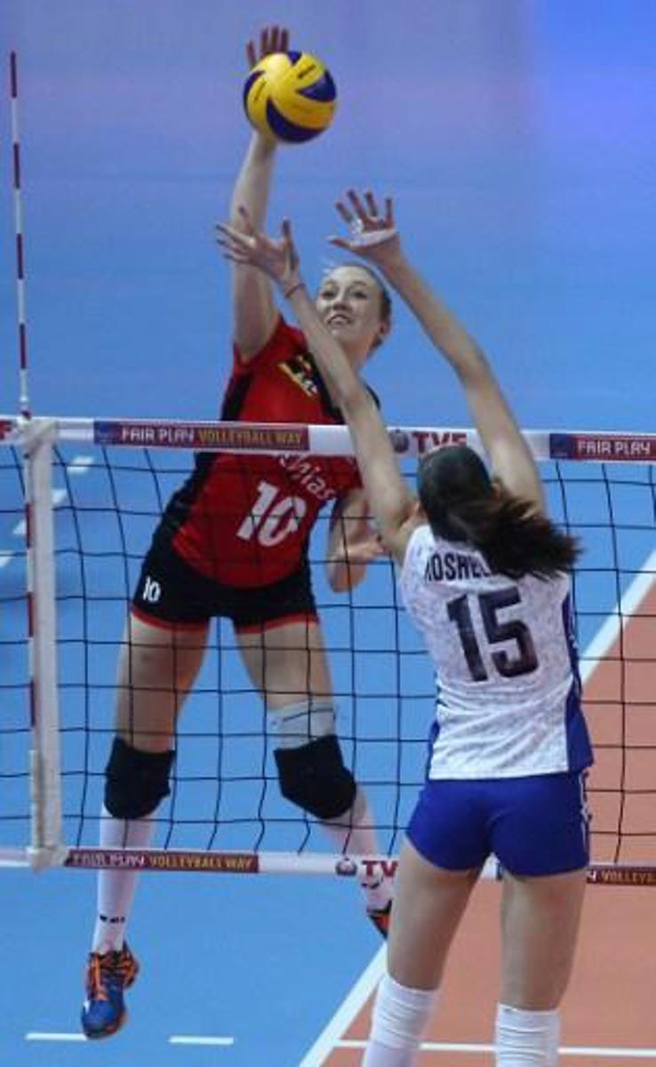 Tatiana Kosoleva (R) of Russ?a jumps for the ball with Lise Van Hecke (L) of Belg?um during the Women's European Olympic Qualification volleyball match between Russia and Belgium at the TVF Baskent Sports Hall in Ankara, on January 7, 2016.   / AFP / ADEM ALTAN
