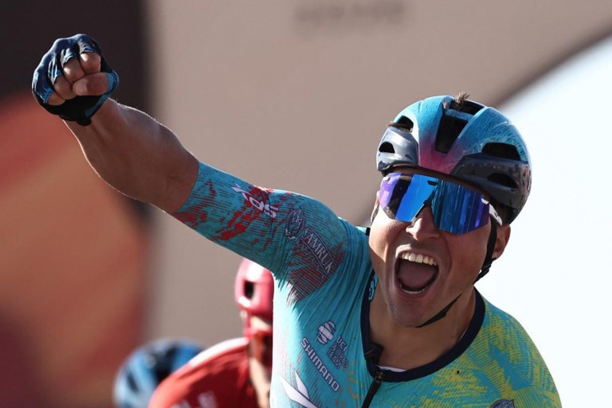 XDS Astana Team Italian Matteo Malucelli celebrates as he crosses the finish ligne to winn the fourth stage of the AlUla Tour cycling race, 173,4 km from Winter Park to Hegra on January 30, 2026.  Anne-Christine POUJOULAT / AFP