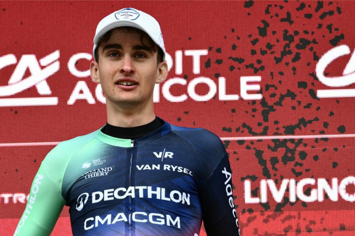 UCI WorldTeam Decathlon CMA CGM's French rider Paul Seixas celebrates on the podium after winning second place in the 20th one-day classic 'Strade Bianche' (White Roads) men's cycling race between Siena and Siena in Tuscany on March 7, 2026.  Marco BERTORELLO / AFP