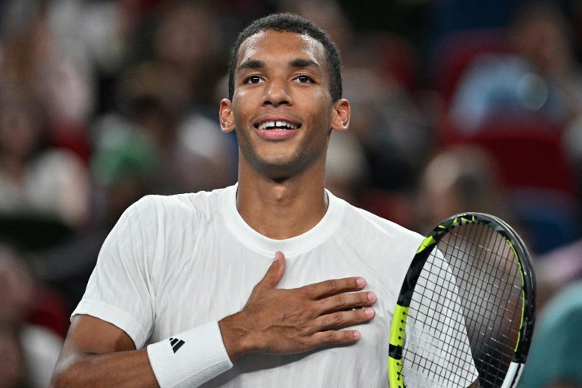 Canada's Felix Auger-Aliassime celebrates after winning against Italy's Lorenzo Musetti during their men's singles match at the Shanghai Masters tennis tournament in Shanghai on October 8, 2025.  Hector RETAMAL / AFP