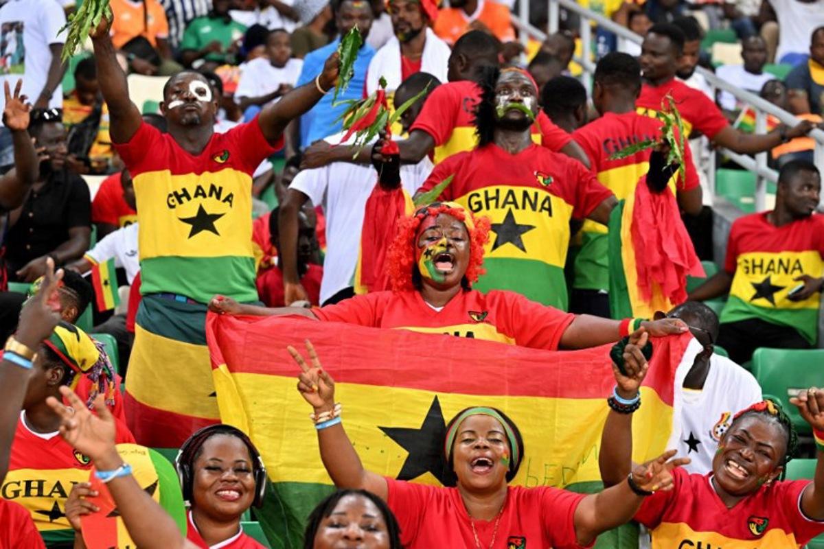Ghana supporters cheer during the Africa Cup of Nations (CAN) 2024 group B football match between Mozambique and Ghana at Alassane Ouattara Olympic Stadium in Ebimpe, Abidjan on January 22, 2024.  Issouf SANOGO / AFP