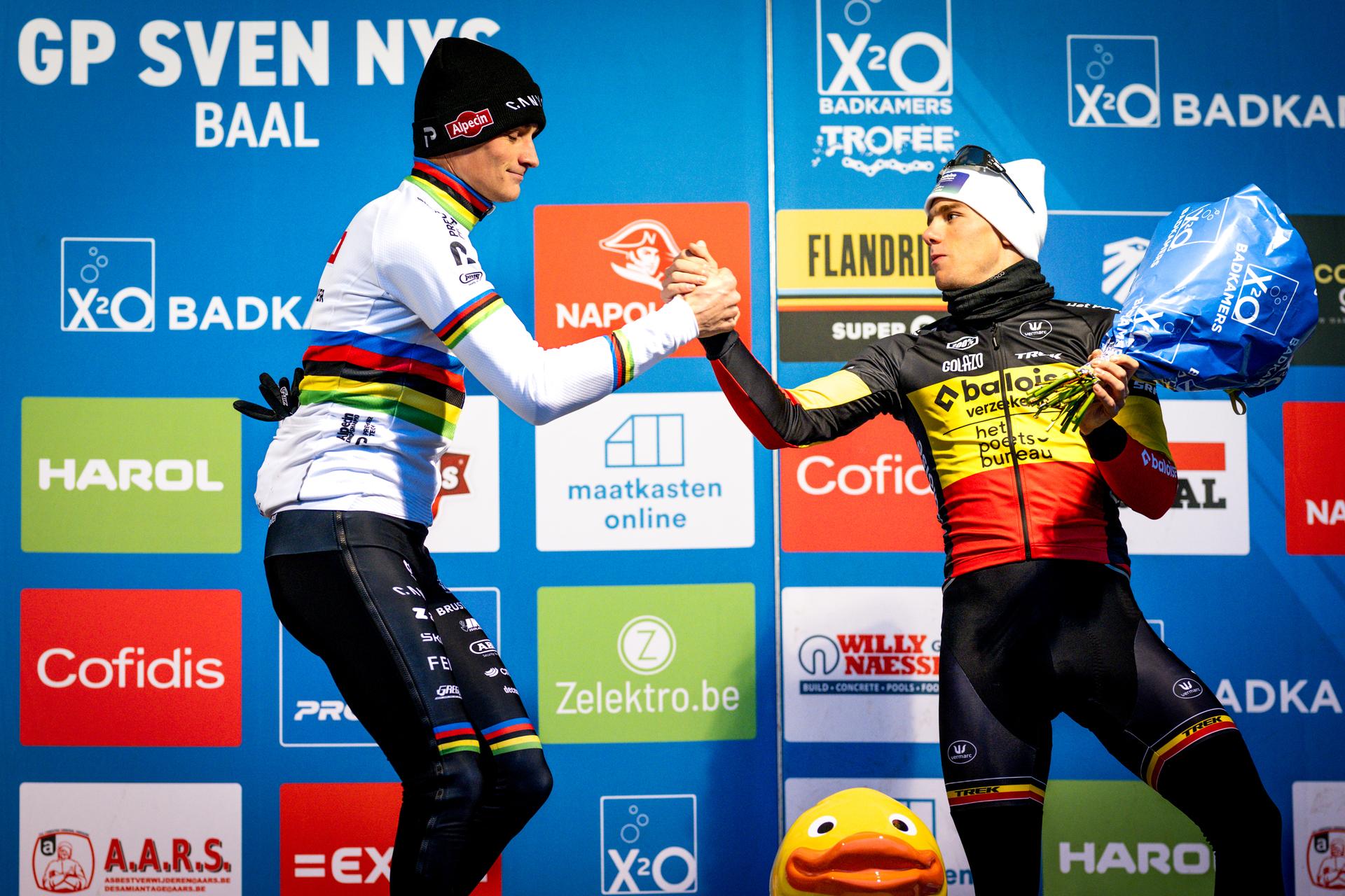 Dutch Mathieu Van Der Poel and Belgian Thibau Nys pictured on the podium after the men's elite race of the 'GP Sven Nys' cyclocross cycling event on Thursday 01 January 2026 in Baal, stage 6/8 in the X2O Badkamers 'Trofee Veldrijden' competition. BELGA PHOTO DAVID PINTENS