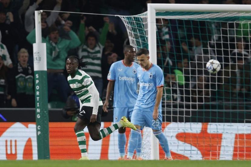 Sporting Lisbon's Portuguese midfielder #07 Geovany Quenda (L) celebrates scoring the opening goal during the UEFA Champions League, league phase day 5 football match between Sporting CP and Club Brugge at Jose Alvalade stadium in Lisbon on November 26, 2025.  FILIPE AMORIM / AFP