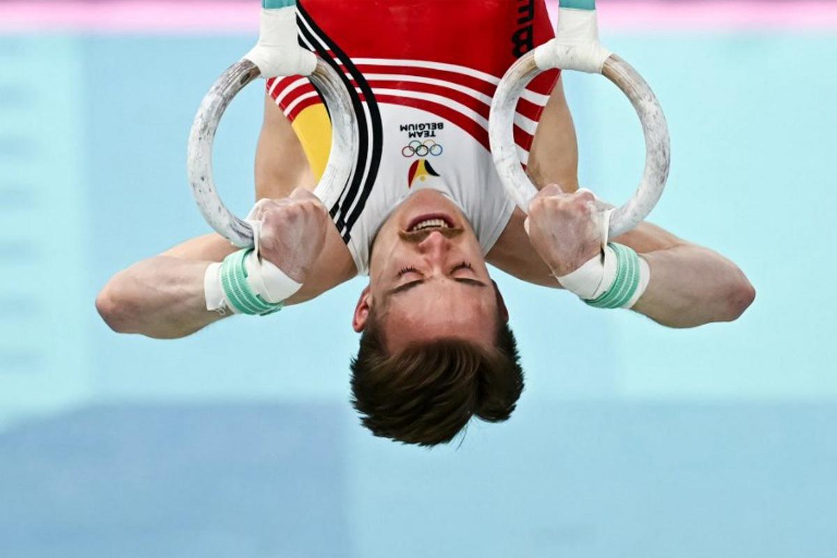Belgium's Glen Cuyle competes in the artistic gymnastics men's rings final during the Paris 2024 Olympic Games at the Bercy Arena in Paris, on August 4, 2024.  Paul ELLIS / AFP