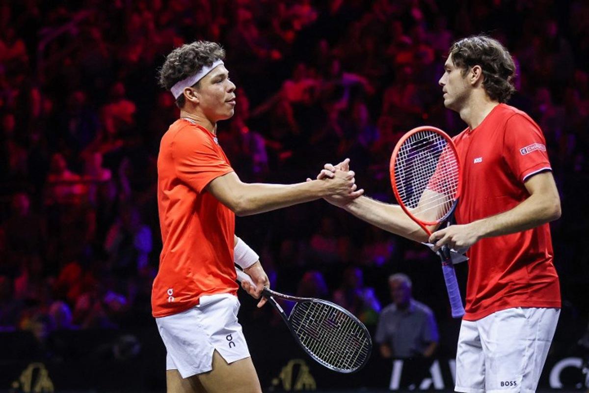 US's Taylor Fritz (R) and US's Ben Shelton (L) of Team World celebrate during their 2024 Laver Cup men's doubles tennis match against Germany's Alexander Zverev and Spain's Carlos Alcaraz of Team Europe, in Berlin, on September 20, 2024.  Ronny Hartmann / AFP