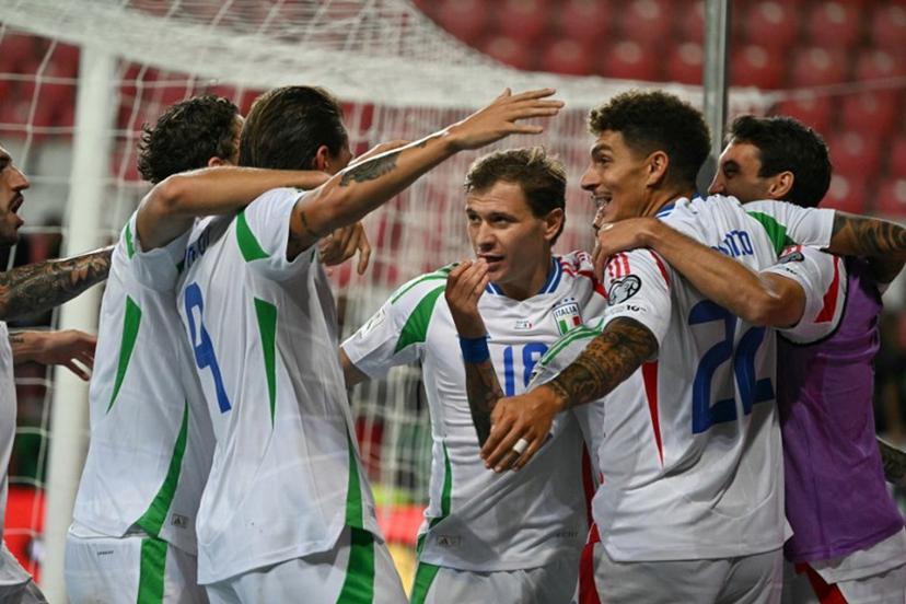 Italy's players celebrate after scoring the 2-3 goal during the 2026 World Cup qualifiers Europe zone group I football match between Israel and Italy on September 8, 2025 in Debrecen, Hungary.  Attila KISBENEDEK / AFP