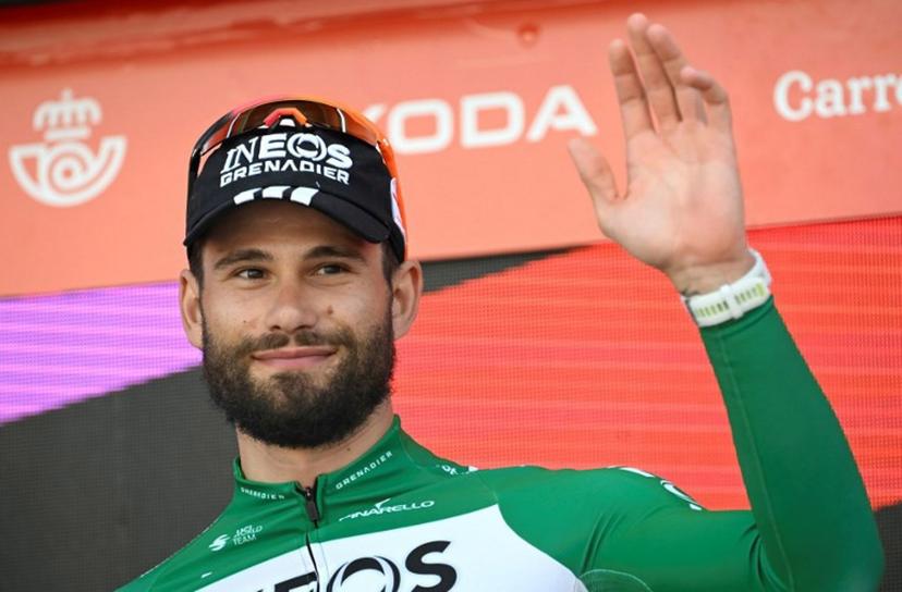 Stage winner team Ineos' Italian rider Filippo Ganna celebrates on the podium after the 18th stage of the Vuelta a Espana, a 26 km race against the clock between Valladolid and Valladolid, on September 11, 2025.    Miguel RIOPA / AFP