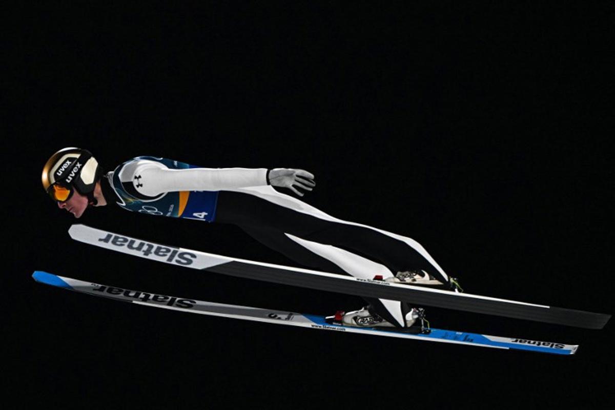 Slovenia's Domen Prevc jumps during the ski jumping mixed team 1st round of the Milano Cortina 2026 Winter Olympic Games at Predazzo Ski Jumping Stadium in Predazzo (Val di Fiemme), on February 10, 2026.  Javier SORIANO / AFP