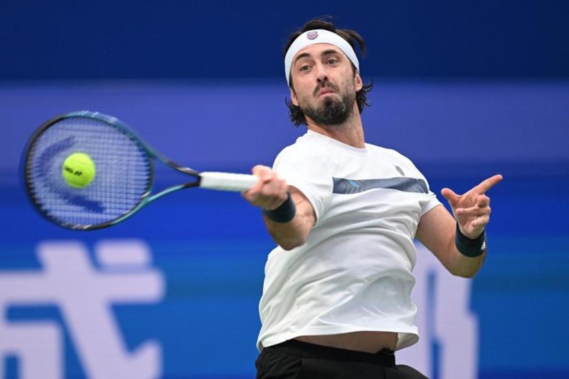 Georgia's Nikoloz Basilashvili hits a return to Spain's Alejandro Davidovich Fokina during their men's singles semi-final match at the Chengdu Open tennis tournament in Chengdu, in China's southwest Sichuan province on September 28, 2026.  AFP