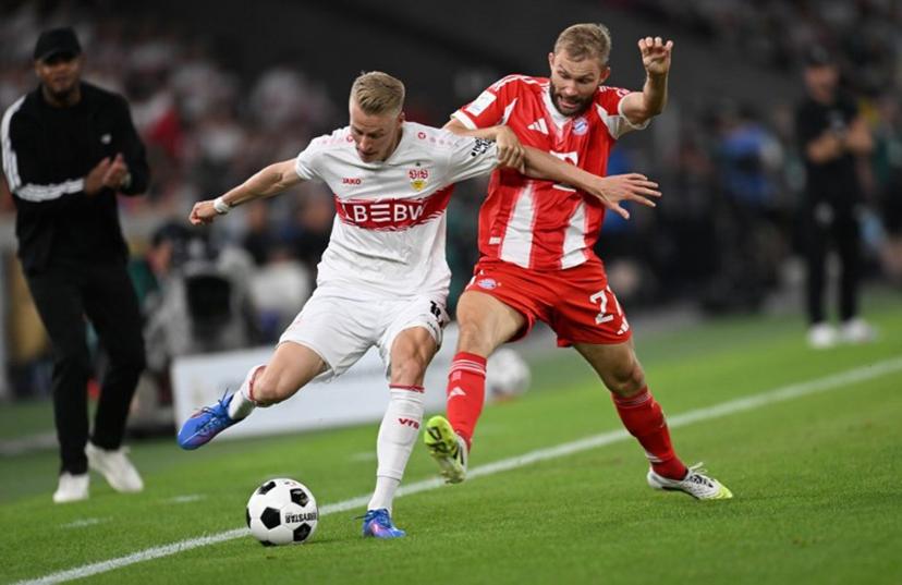 Stuttgart's German midfielder #10 Chris Fuehrich (L) and Bayern Munich's Austrian midfielder #27 Konrad Laimer vie for the ball during the Franz-Beckenbauer Supercup football match between VfB Stuttgart and FC Bayern Munich in Stuttgart, southern Germany on August 16, 2025. Originally established in 1987 by the German Football Association (DFB) as the as the DFB-Supercup, The Franz Beckenbauer Supercup, is a single football match between the Bundesliga champion and the DFB-Pokal winner, organized by the German Football League (DFL). THOMAS KIENZLE / AFP