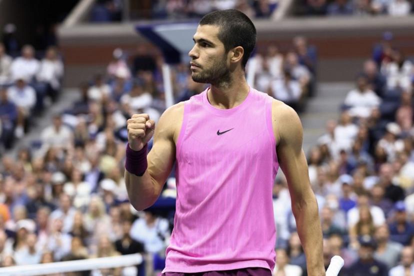 Spain's Carlos Alcaraz celebrates after a point against Italy's Jannik Sinner during the men's singles final tennis match on day fifteen of the US Open tennis tournament at the USTA Billie Jean King National Tennis Center in New York City on September 7, 2025.  CHARLY TRIBALLEAU / AFP