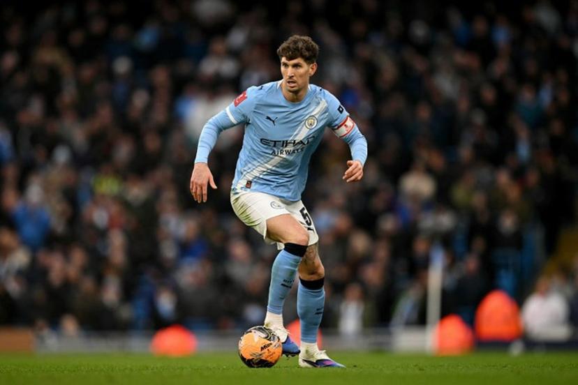 Manchester City's English defender #05 John Stones runs with the ball during the English FA Cup third round football match between Manchester City and Salford City at the Etihad Stadium in Manchester, north west England, on February 14, 2026.  Oli SCARFF / AFP