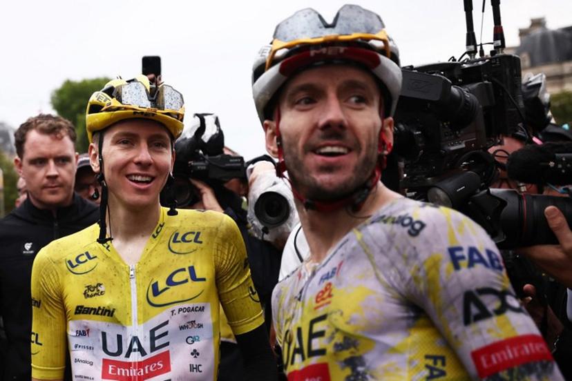 UAE Team Emirates - XRG team's Slovenian rider Tadej Pogacar celebrates his overall victory with UAE Team Emirates - XRG team's British rider Adam Yates after the 21st and final stage of the 112th edition of the Tour de France cycling race, 132.3 km between Mantes-la-Ville and Paris Champs-Élysees, on July 27, 2025.  Anne-Christine POUJOULAT / AFP