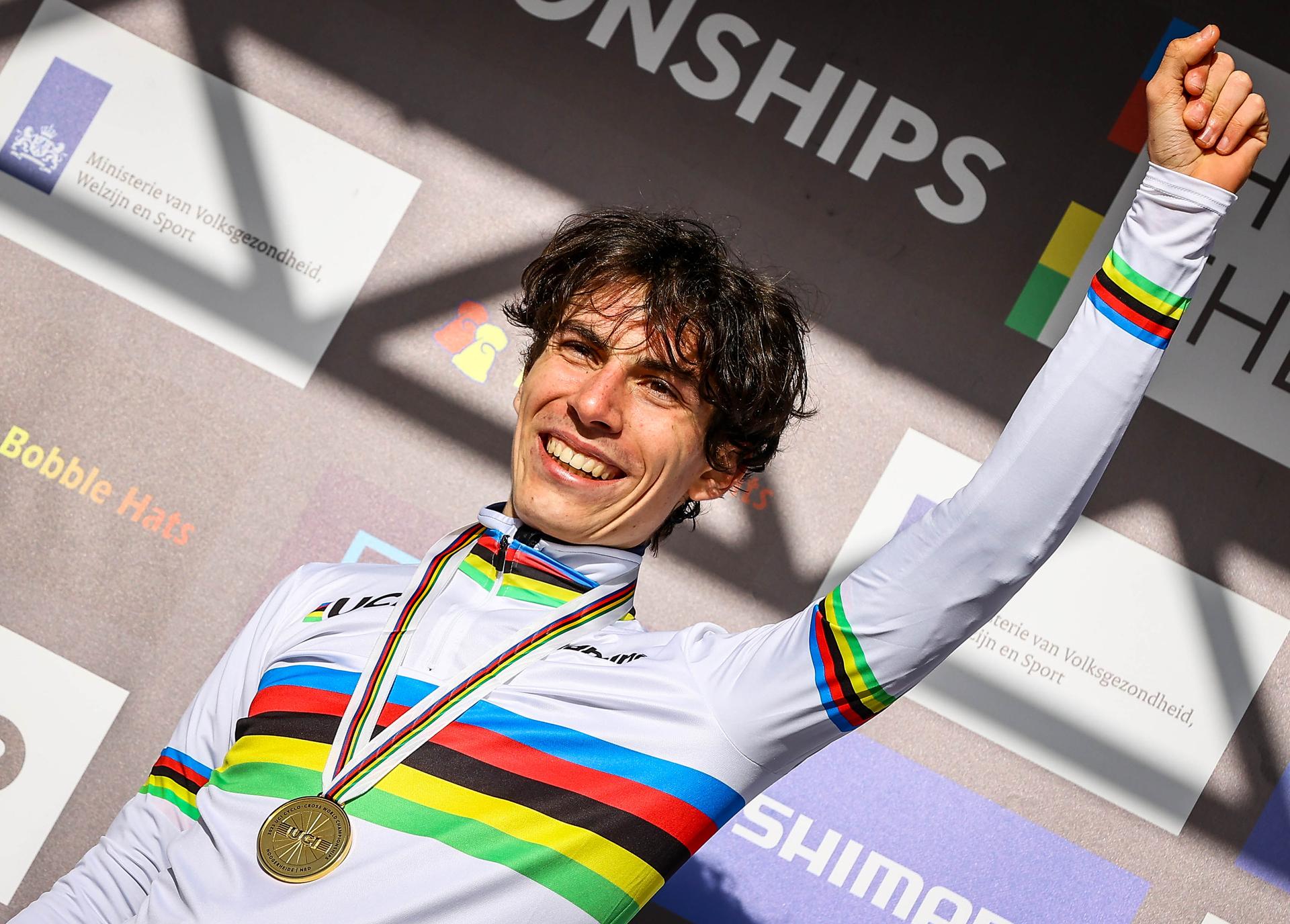 French Leo Bisiaux celebrates on the podium after winning the Men Junior race at the UCI Cyclocross World Championships, in Hoogerheide, The Netherlands on Sunday 05 February 2023. BELGA PHOTO DAVID PINTENS