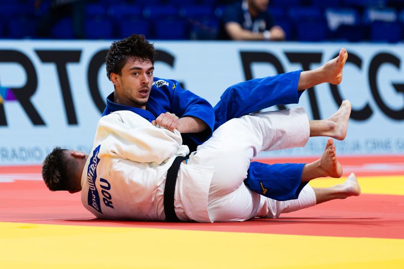 Belgian Zelemkhan Batchaev (blue) and Romanian Lucian Dumitrescu (white) pictured in action during a fight in the Men -73kg, at the European Judo Championships in Podgorica, Montenegro, on Thursday 24 April 2025. The tournament is taking place from 23 tot 27 April 2025. BELGA PHOTO NIKOLA KRISTC