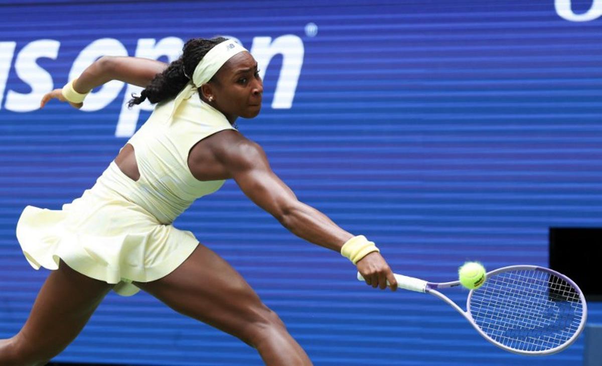 USA's Coco Gauff reaches to return the ball to Russia's Mirra Andreeva during their women's singles quarter-final tennis match on day eleven of the US Open tennis tournament at the USTA Billie Jean King National Tennis Center in New York on September 9, 2026.  TIMOTHY A. CLARY / AFP