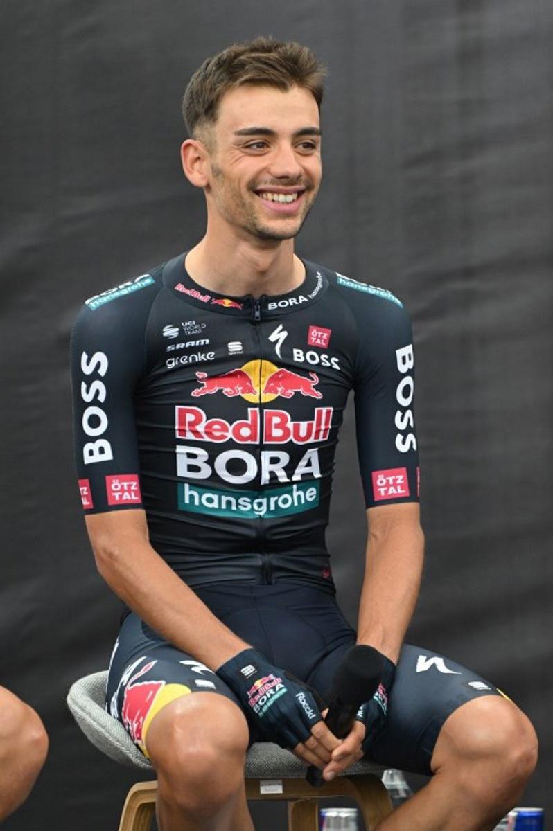 Italy's Matteo Sobrero attends the presentation of the new Red Bull-Bora-Hansgrohe cycling team in Salzburg, Austria, on June 26, 2024. Red Bull on June 26, 2024 unveiled its eight-rider cycling team to debut in this week's Tour de France, marking the energy drink maker's latest expansion of its sports empire. Earlier this year, Red Bull bought a controlling stake in the German Bora-Hansgrohe cycling team.  KERSTIN JOENSSON / AFP