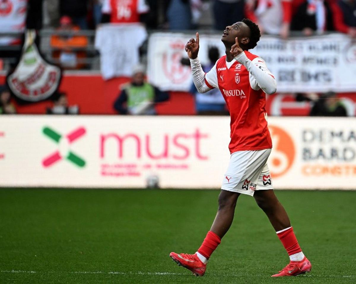 Reims' French forward #67 Mamadou Diakhon   celebrates after scoring his team's second goal during the French L1 football match between Stade de Reims and Olympique de Marseille (OM) at Stade Auguste-Delaune in Reims, northern France on March 29, 2025.  FRANCOIS NASCIMBENI / AFP