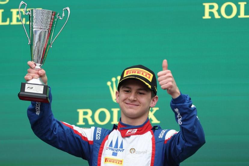 Second-placed Trident's Italian driver Leonardo Fornaroli celebrates on the podium after the Australia Formula 3 Grand Prix at the Albert Park Circuit in Melbourne on March 24, 2024.  Martin KEEP / AFP