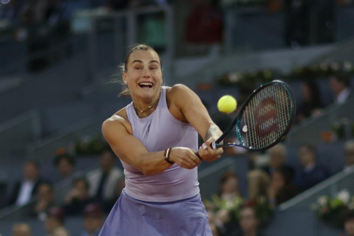 Belarus' Aryna Sabalenka returns a ball to Ukraine's Marta Kostyuk during their 2025 WTA Tour Madrid Open tennis tournament quarter finals singles match at the Caja Magica in Madrid, on April 30, 2025.  OSCAR DEL POZO / AFP