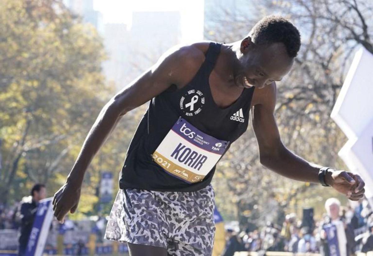 Men's division winner Albert Korir of Kenya crosses the finish line during the 2021 TCS New York City Marathon in New York on November 7, 2021. After a forced break in 2020, the New York City Marathon is back on for its 50th edition, and with it the countless opportunities to run it for charity, an industry that has become a staple, and hopes to take off again after the pandemic. TIMOTHY A. CLARY / AFP