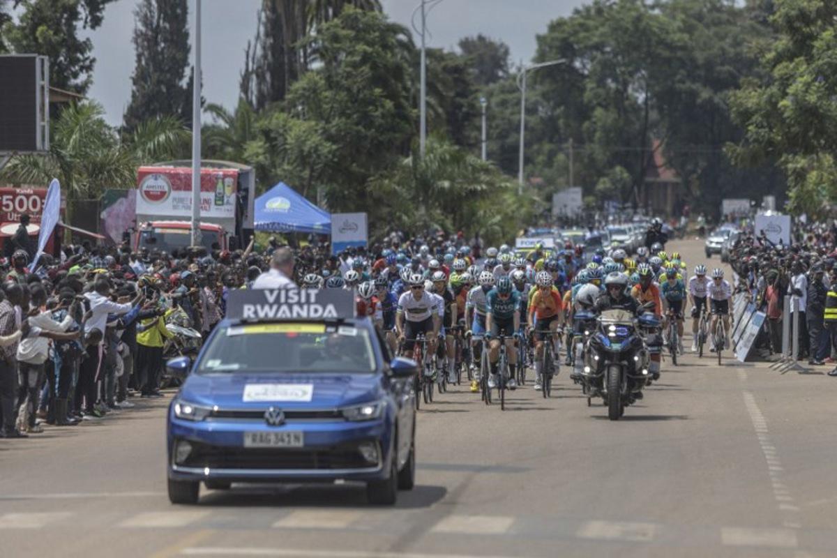 The pack rides at the start line of the third stage of the 16th Tour du Rwanda in Huye on February 20, 2024.    Guillem Sartorio / AFP
