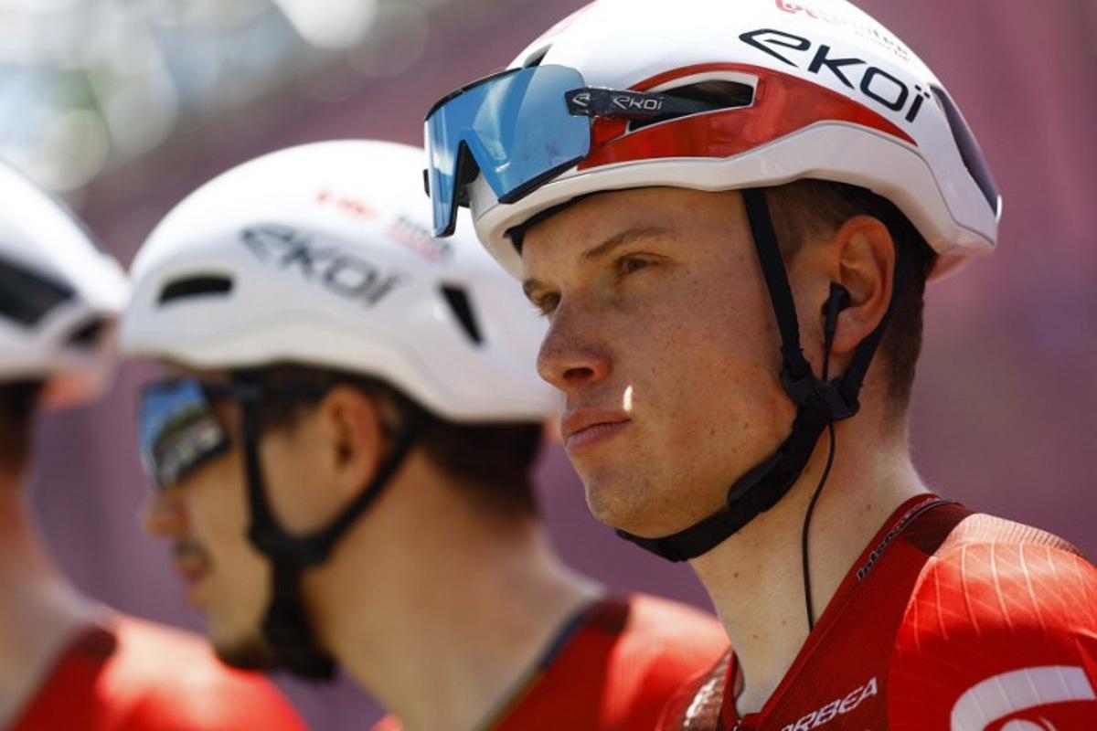 Lotto Intermarche Belgian rider Lennert Van Eetvelt looks on during the presentation prior the 4th stage of the Giro d'Italia 2026 - Tour of Italy cycling race between Catanzaro and Cosenza, Italy, on May 12, 2026.  Luca Bettini / AFP