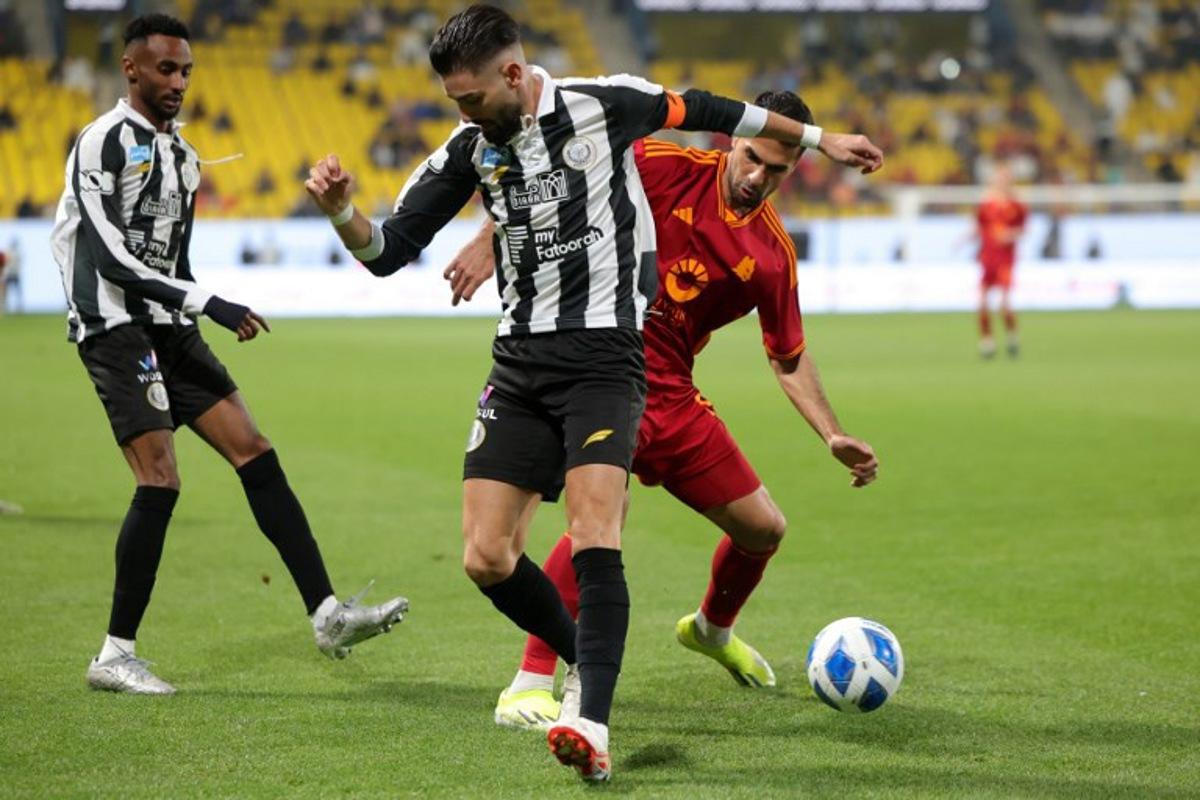 Shabab's Belgian midfielder #23 Yannick Carrasco(L) fights for the ball with Shabab's English midfielder #19 Mo Adams, during their friendly football match at Al-Awwal Park in Riyadh, on January 24, 2024.  Fayez NURELDINE / AFP
