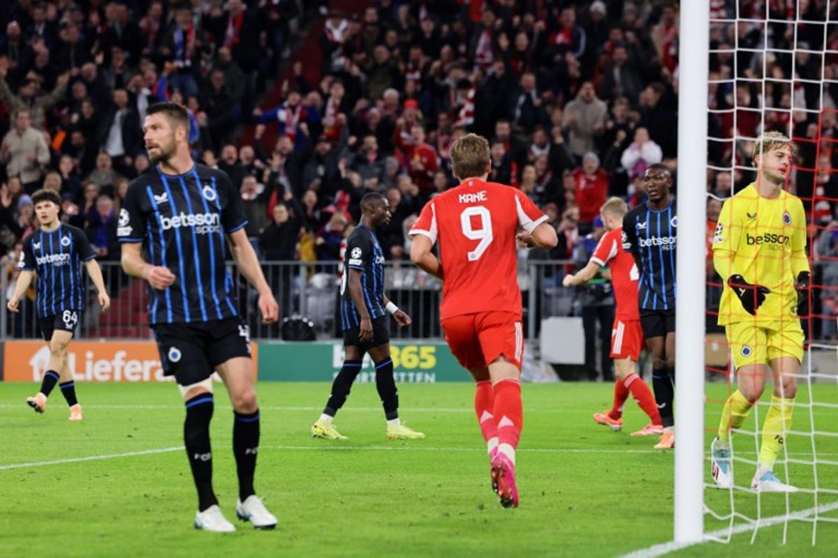 Bayern Munich's English forward #09 Harry Kane (C) celebrates scoring his team's second goal past Club Brugge's Belgian goalkeeper #29 Nordin Jackers (R) during the UEFA Champions League football match between FC Bayern Munich and Club Brugge in Munich, southern Germany on October 22, 2025.  Alexandra BEIER / AFP