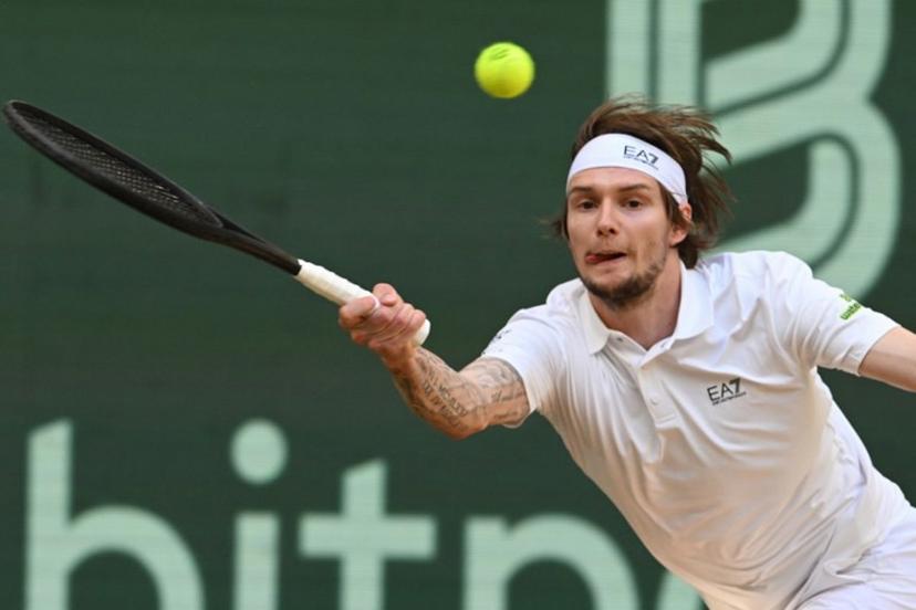 Kazakhstan's Alexander Bublik returns the ball to Russia's Karen Khachanov (not in picture) during the men's singles semi-final match at the Halle Open ATP tennis tournament in Halle, western Germany, on June 21, 2025.  CARMEN JASPERSEN / AFP