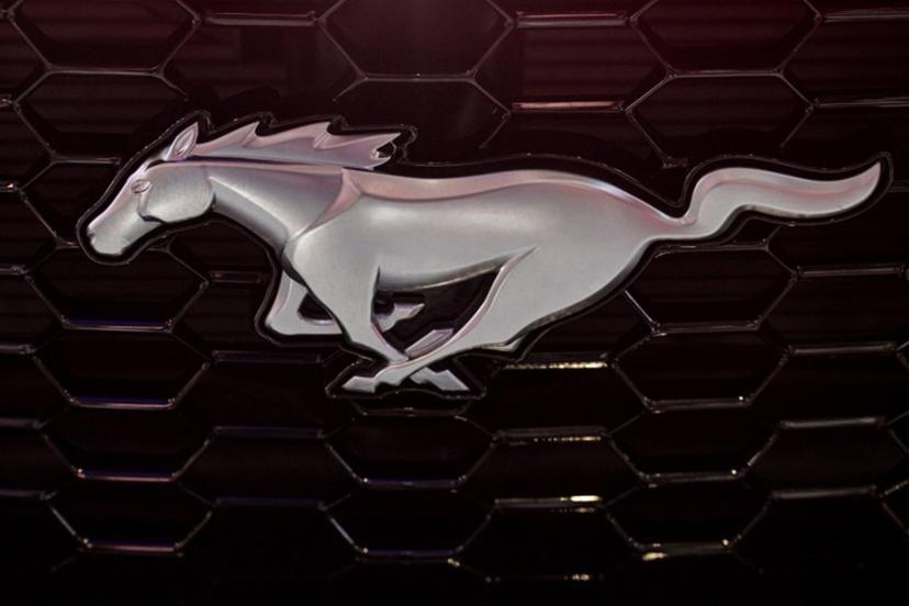 A Ford Mustang logo on is seen during the 21st Shanghai International Automobile Industry Exhibition at the National Exhibition and Convention Center in Shanghai on April 24, 2025.  Hector RETAMAL / AFP