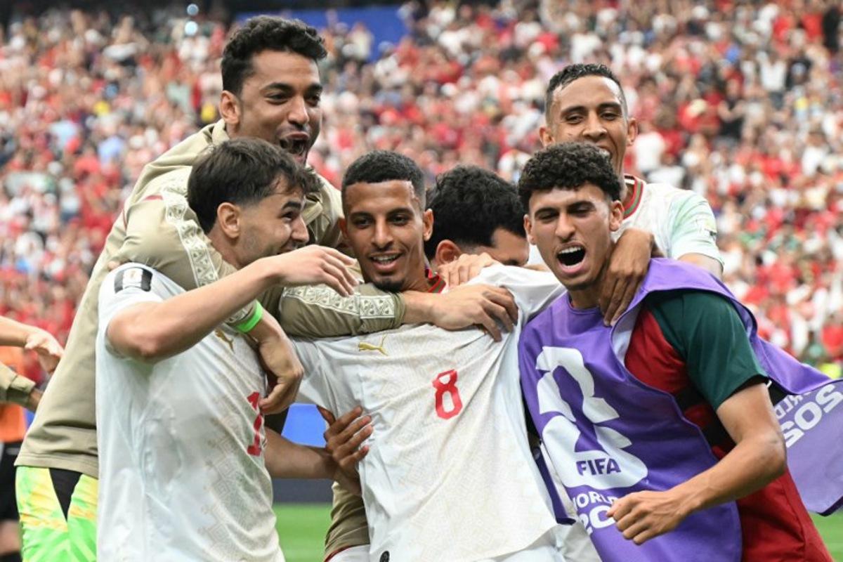 Morocco's midfielder #08 Azzedine Ounahi celebrates scoring his team's second goal with teammates during the 2026 World Cup round of 16 football match between Canada and Morocco at the Houston Stadium in Houston on July 4, 2026.   RONALDO SCHEMIDT / AFP