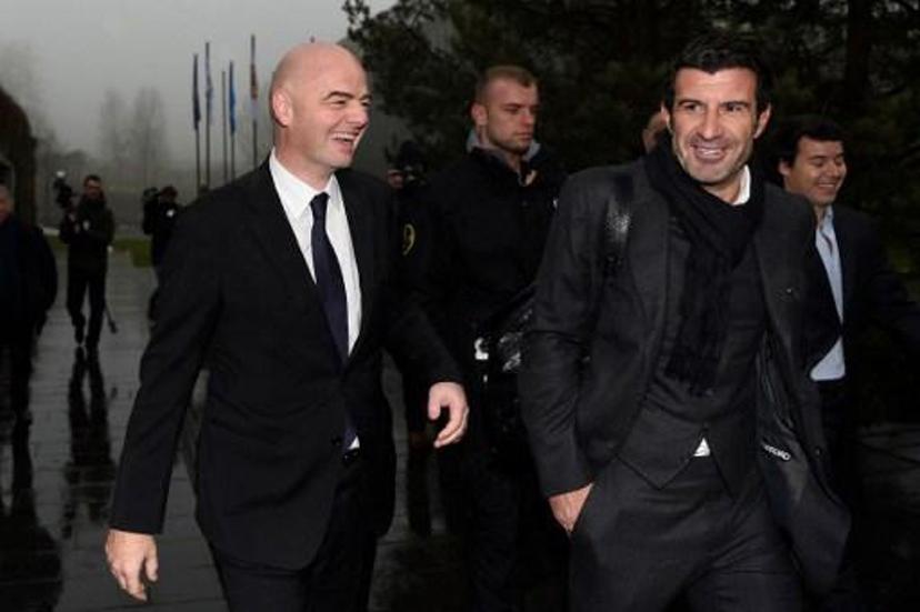 Newly-elected FIFA president Gianni Infantino (L) and former Portuguese international player Luis Figo (R) arrive at the FIFA headquarters on February 29, 2016 in Zurich.  Gianni Infantino insisted on February 28, 2016 that FIFA's reform package would close the door on a chapter of pain at world football's governing body and usher in an era of joy. / AFP / VALERIANO DI DOMENICO