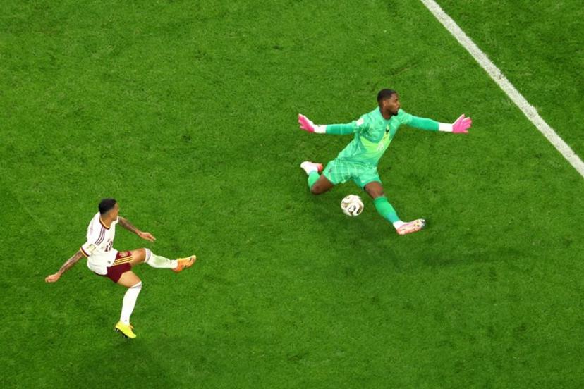 Spain's defender #12 Pedro Porro scores his team's second goal past France's goalkeeper #16 Mike Maignan during the 2026 World Cup football tournament semi-final match between France and Spain at the Dallas Stadium in Arlington on July 14, 2026.   Odd ANDERSEN / AFP
