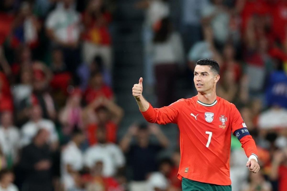 Portugal's forward #16 Cristiano Ronaldo celebrates scoring his team's second goal during the 2026 World Cup qualifiers Europe zone group F football match between Portugal and Hungary at Jose Alvalade stadium in Lisbon on October 14, 2025.  PATRICIA DE MELO MOREIRA / AFP