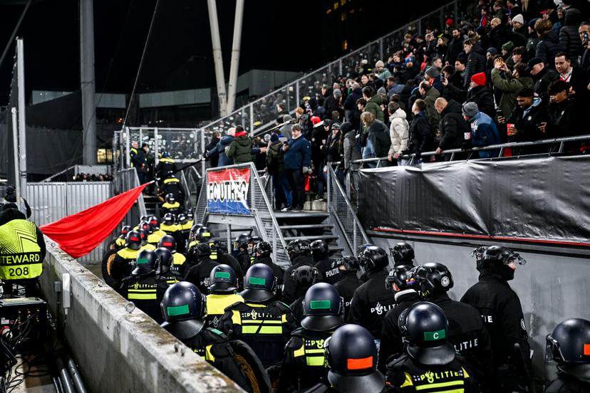Dutch police officers are pictured walking towards the away section ahead of a soccer game between Dutch soccer club FC Utrecht and Belgian KRC Genk, on Thursday 22 January 2026 in Utrecht, Netherlands, the seventh game (out of 8) in the league phase of the UEFA Europa League competition. BELGA PHOTO TOM GOYVAERTS
