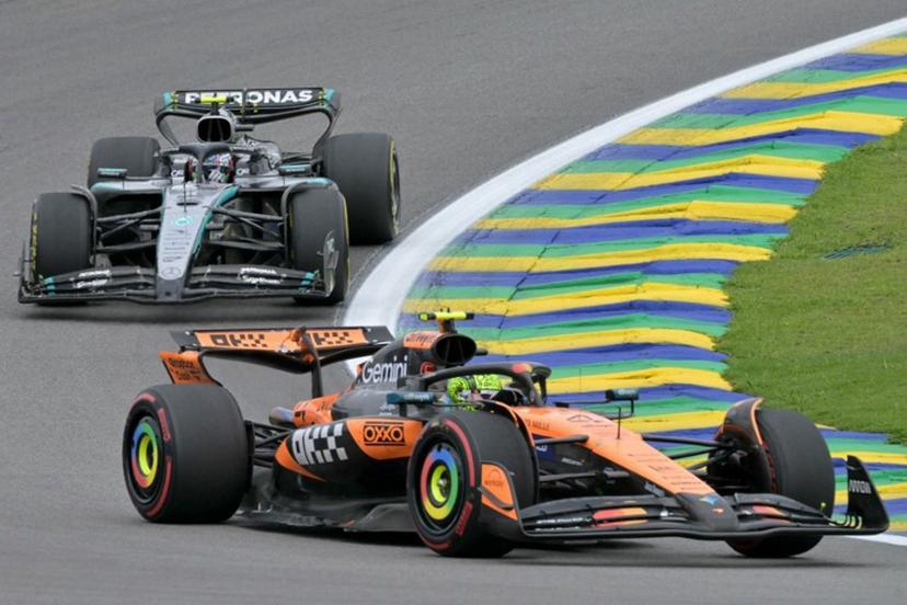 McLaren's British driver Lando Norris (Bottom) races in the lead ahead of Mercedes' Italian driver Kimi Antonelli (Top) during the sprint of the Sao Paulo Formula One Grand Prix at the Jose Carlos Pace racetrack, aka Interlagos, in Sao Paulo, Brazil on November 8, 2025.  Nelson ALMEIDA / AFP
