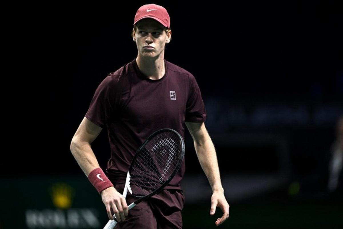 Italy's Jannik Sinner reacts as he plays against US Ben Shelton during their men's singles quarter-final match on day five of the Paris ATP Masters 1000 tennis tournament at the Paris La Défense Arena in Nanterre, on the outskirts of Paris, on October 31, 2025.  JULIEN DE ROSA / AFP
