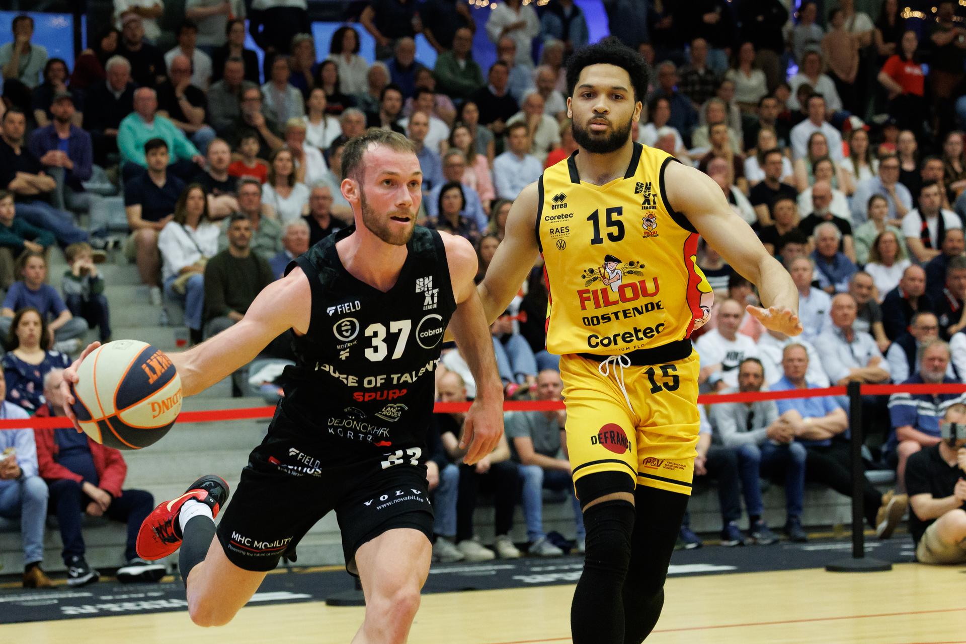 Kortrijk's Leon Stergar and Oostende's Caleb Daniels fight for the ball during a basketball match between House of Talents Spurs Kortrijk and BC Oostende, Friday 04 April 2025 in Kortrijk, on day 31 of the 'BNXT League' Belgian/ Dutch first division basket championship. BELGA PHOTO KURT DESPLENTER