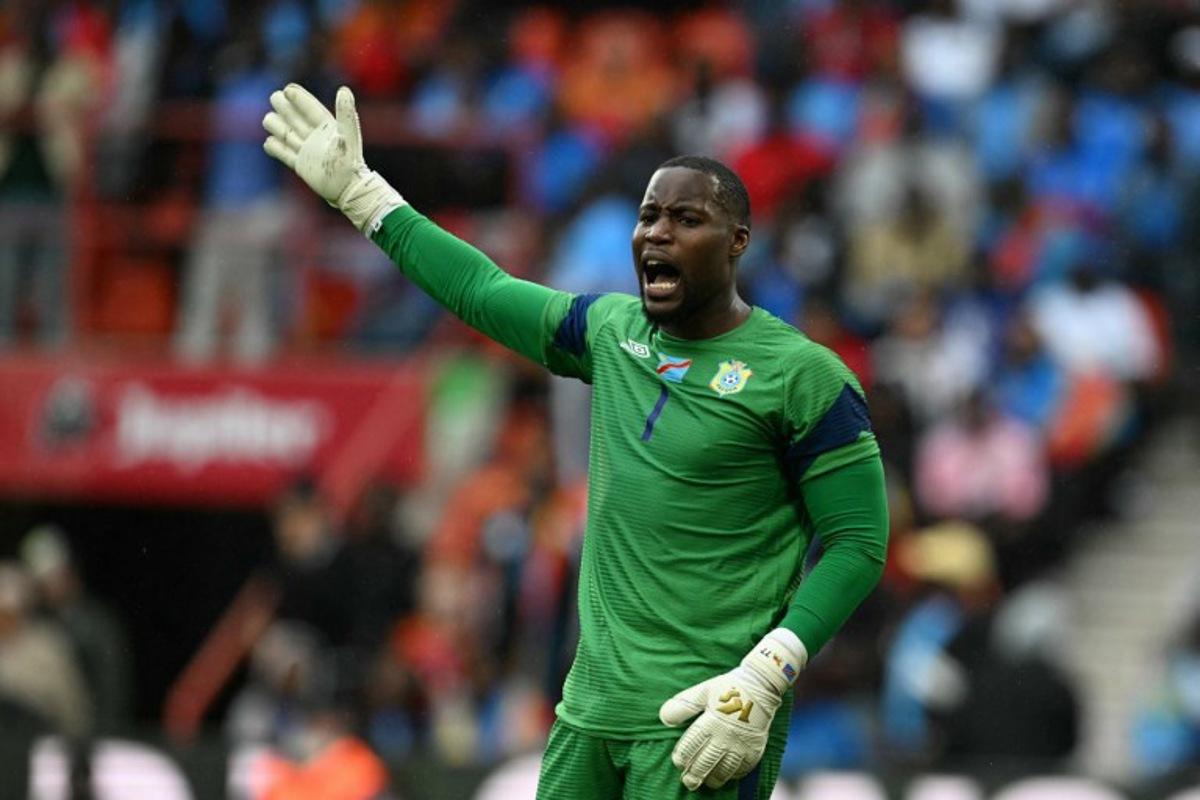 Congo's dgoalkeeper #01 Lionel Mpasi reacts during the international friendly football match between Denmark and DR Congo ahead of the 2026 FIFA World Cup football tournament at the Stade Maurice Dufrasne in Liege on June 3, 2026.  NICOLAS TUCAT / AFP