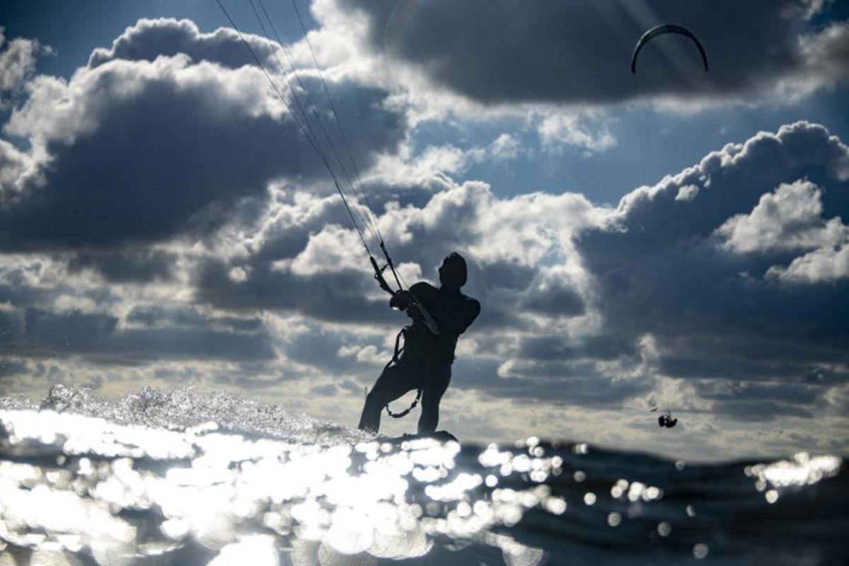 A kitesurfer catches air of the coast in Lège-Cap Ferret, southwestern France on June 8 2020.     Olivier MORIN / AFP