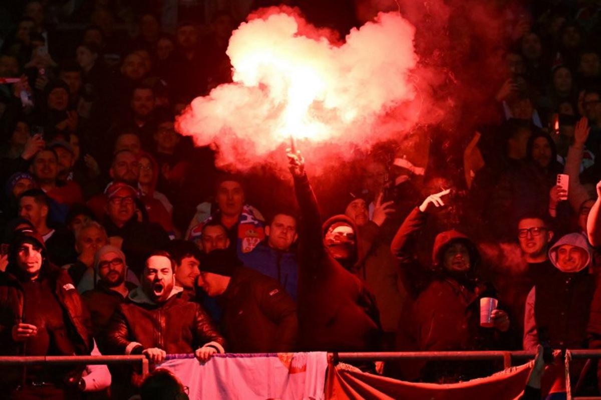 Serbian fans light flares during the UEFA Nations League play-off, first-leg football match Austria v Serbia at the Ernst Happel Stadium in Vienna on March 20, 2025.   Joe Klamar / AFP