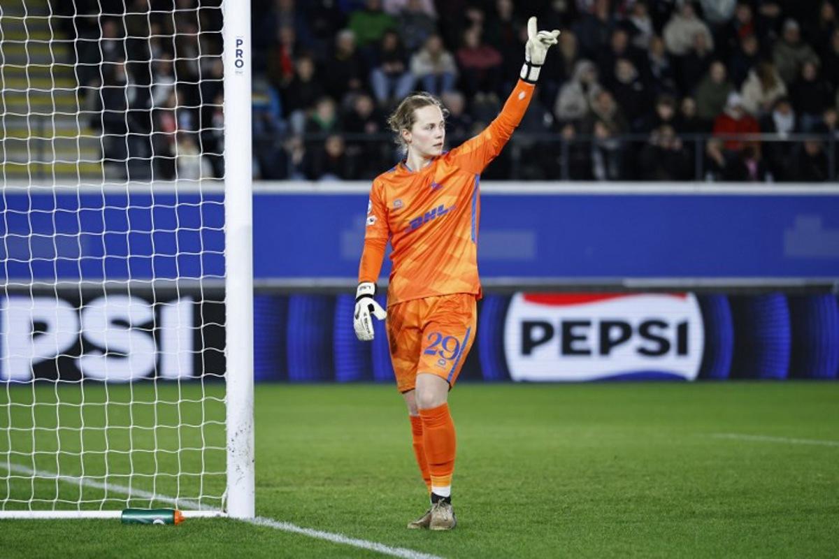 Leuven's Belgian goalkeeper #29 Lowiese Seynhaeve gestures during the UEFA Women's Champions League knockout play-off in first-leg match between Oud-Heverlee Leuven and Arsenal FC at the Den Dreef Stadium in Leuven on February 11, 2026.  Simon Wohlfahrt / AFP
