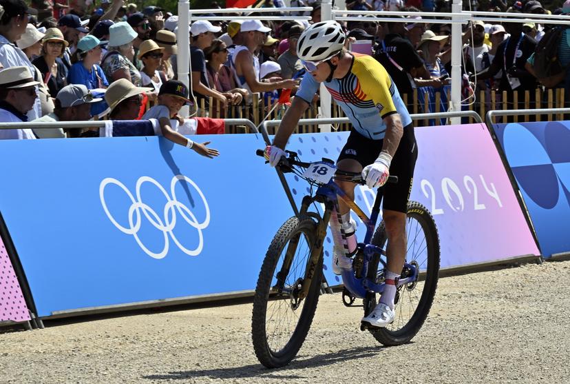 Belgian Jens Schuermans looks dejected after the men's cross-country mountain bike cycling race at the Paris 2024 Olympic Games, at the Colline d'Elancourt climb near Paris, France on Monday 29 July 2024. The Games of the XXXIII Olympiad are taking place in Paris from 26 July to 11 August. The Belgian delegation counts 165 athletes competing in 21 sports. BELGA PHOTO DIRK WAEM